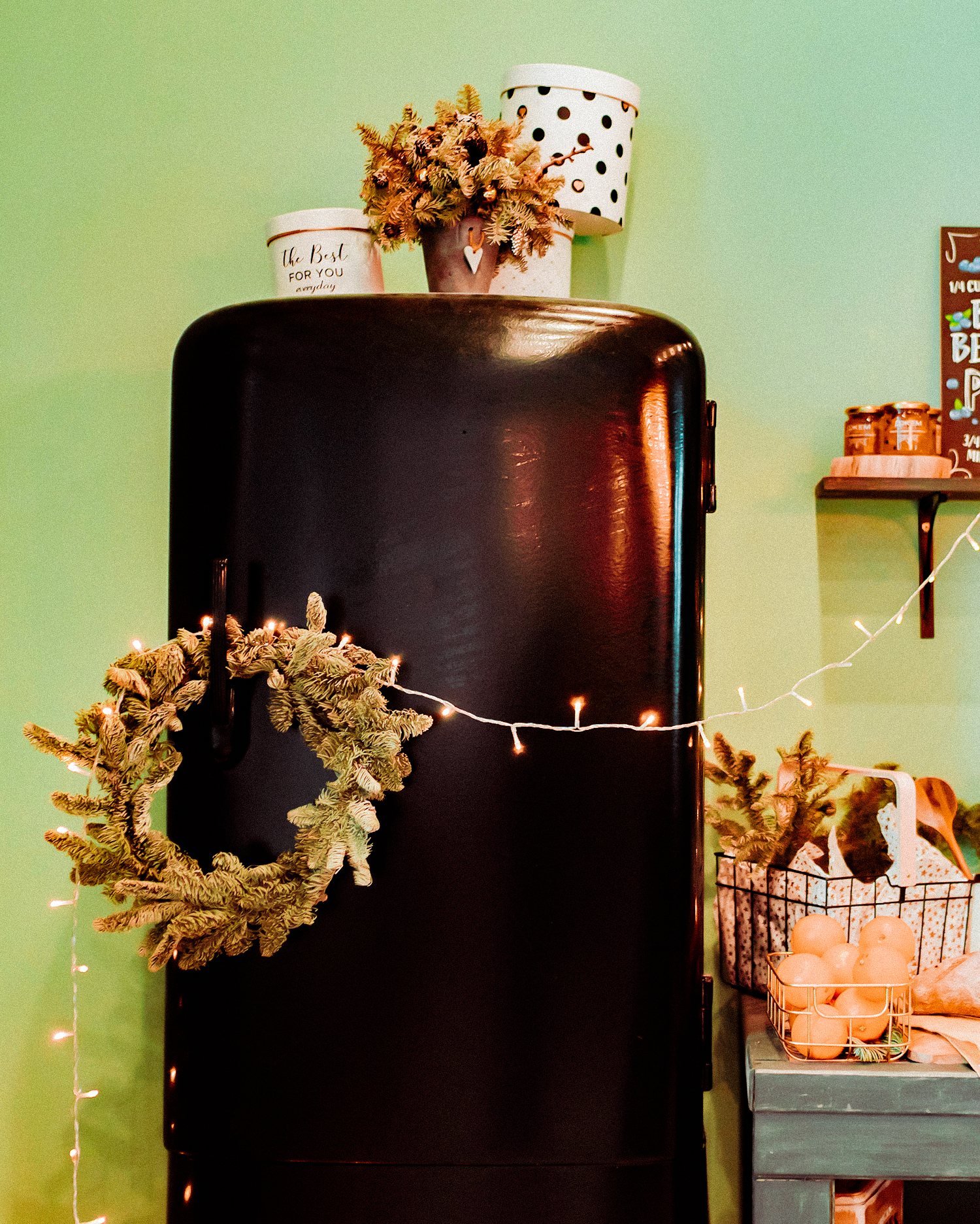 The decor of Christmas and New year.  Kitchen with black retro refrigerator