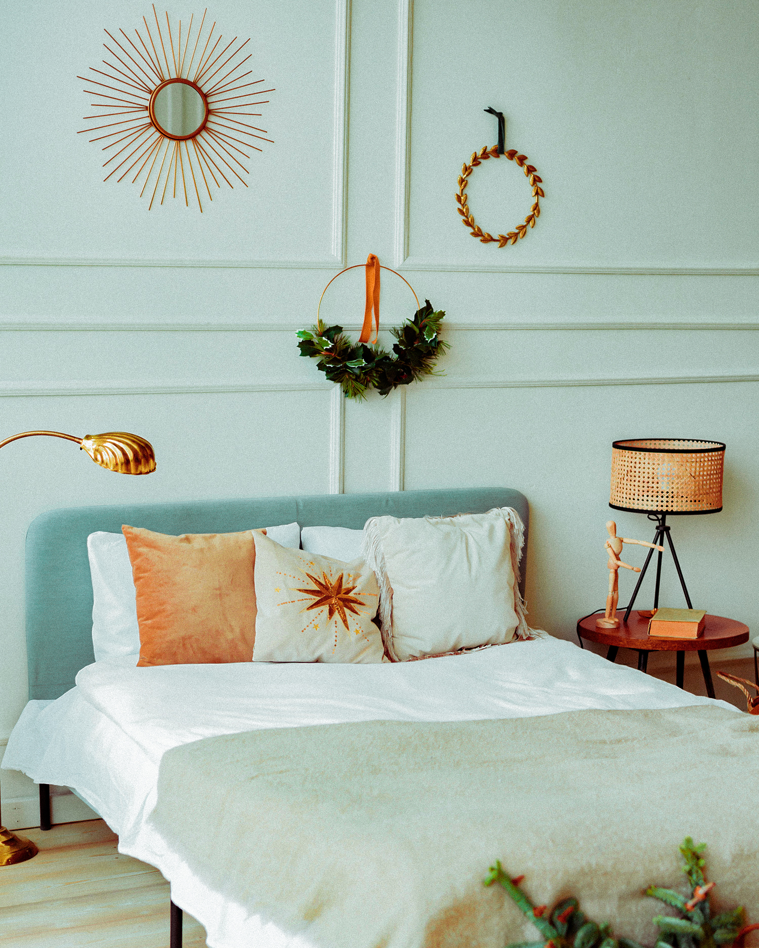 Сozy bedroom with bed and christmas garland lights at home