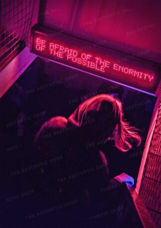 Aesthetic image of nightclub with neon sign that says "Be Afraid at the Enormity of the Possible"